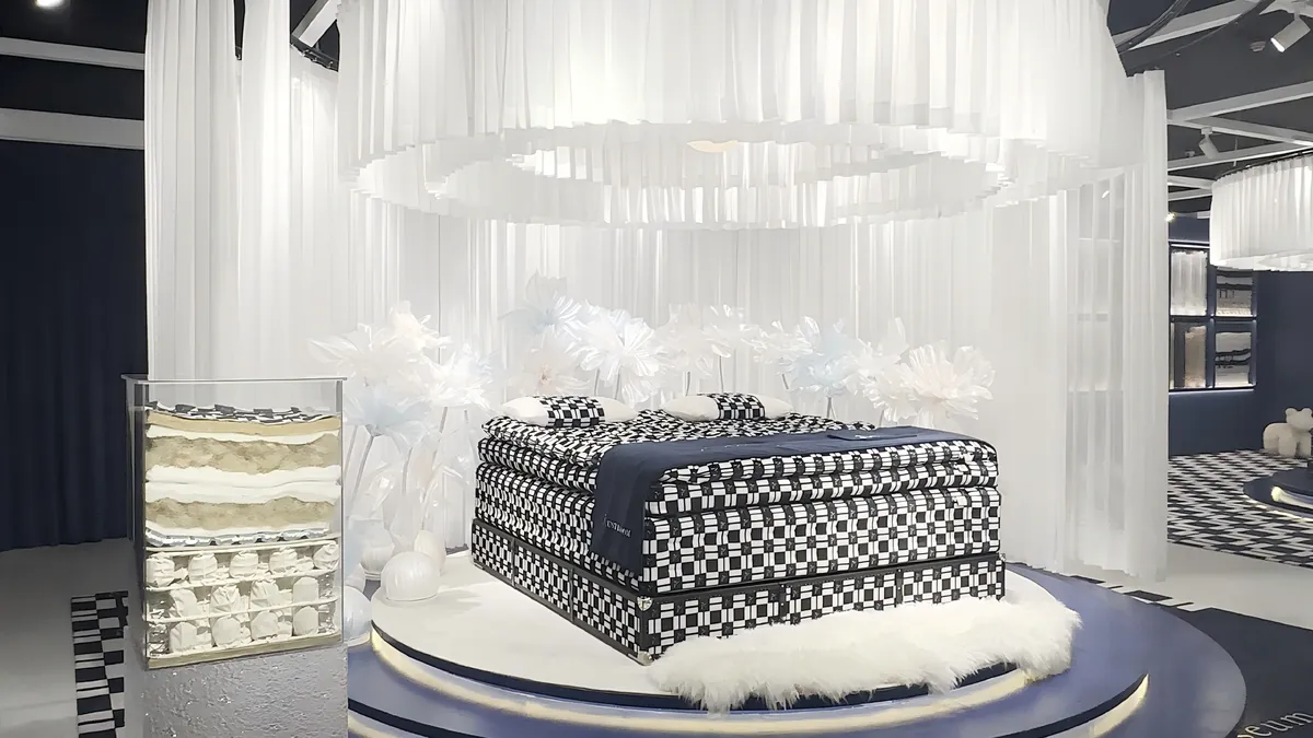 A mattress and bed display in a showroom.